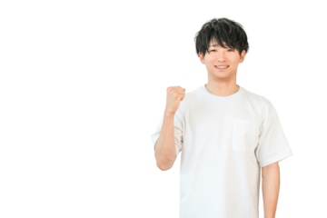 A young Asian man in a T-shirt pumping his fist (motivated, expectant, happy, successful, energetic, pleased, delighted)