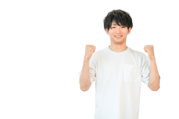 A young Asian man in a T-shirt pumping his fist (motivated, expectant, happy, successful, energetic, pleased, delighted)