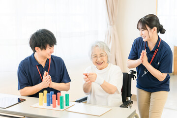 Occupational therapists working at nursing homes and rehabilitation facilities and senior women...
