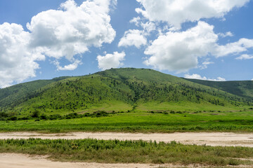 Fototapeta premium The Ngorongoro Crater is home to vast grasslands and a variety of animals.
