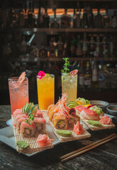 Assorted sushi and maki rolls on wooden table, Japanese food concept © Yuri - Supay 