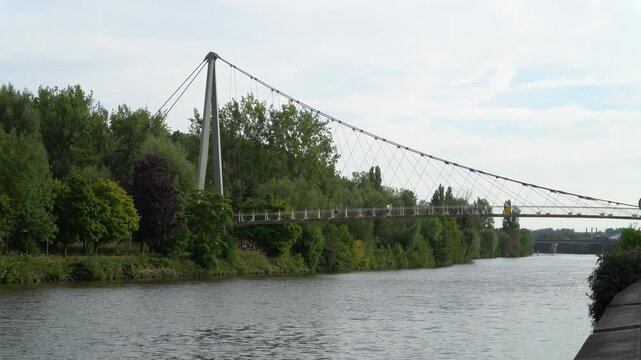Pedestrian bridge spanning the Oise river in Creil, Oise, northern France.
