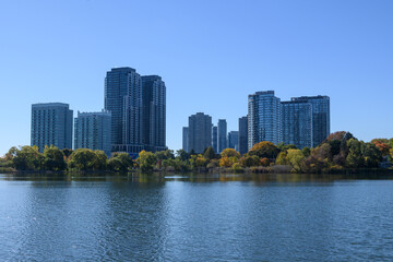 Fototapeta premium Etobicoke Toronto skyline reflecting autumn colors in waterfront lake