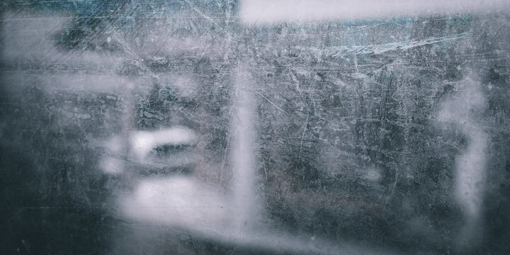 The surface texture of the window glass is very dirty with thick stains and dust.