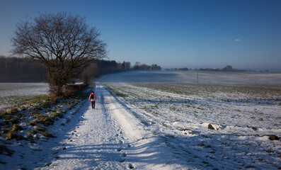 woman walking in winter snow