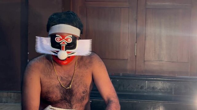 Rare kathakali artist preparing for performance