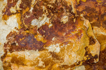 Naklejka premium Stone structures and grain patterns in reddish brown