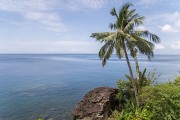 tropical scenery blue ocean blue sky Islands in the Background