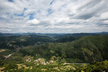 Mountain and forest with dramatic cloudy sky