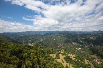 Fototapeta premium Mountain and forest with dramatic cloudy sky