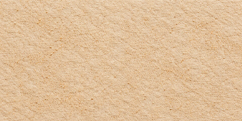 A vintage kraft brown paper texture background featuring a rough aged cardboard surface with a blank grunge pattern and antique beige material design