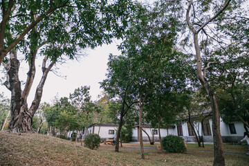 Serene Park with Trees and Modern Buildings, West Lake in Huizhou, Guangdong Province, Asia China, is a tourist attraction featuring ancient architecture