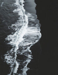 Moody Black Volcanic Sand Beach and Ocean Foam Landscape