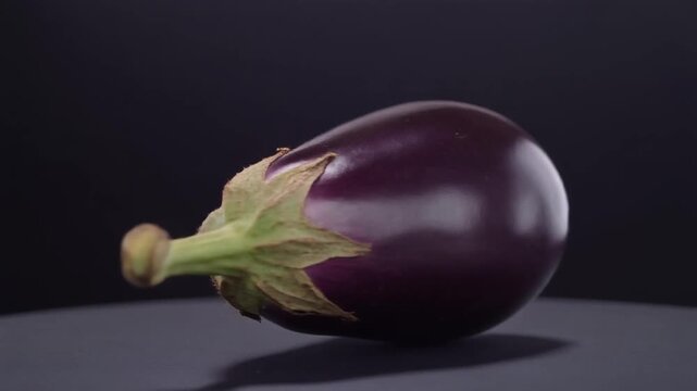 Closeup of purple eggplant on table.