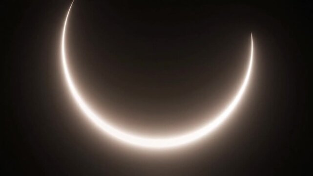 A crescent-shaped solar eclipse viewed from space during the day with a dark background and a glowing ring of light