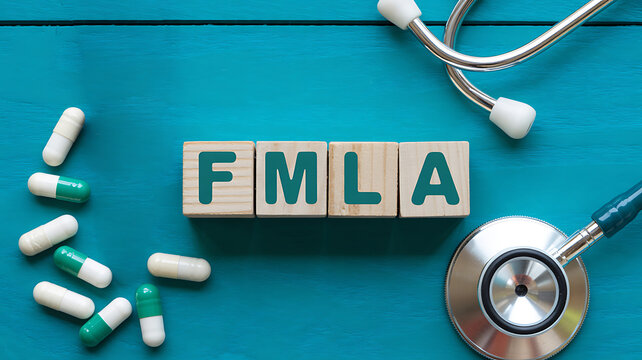 Family and Medical Leave Act text on blocks with pills and stethoscope fmla health care medications doctor nurse healthcare employee benefits