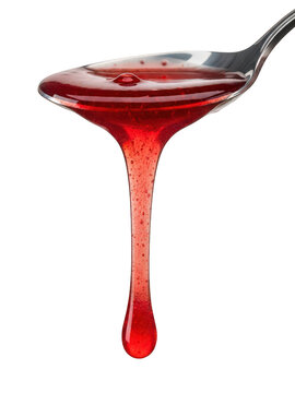 Red syrup dripping from spoon isolated on transparent background