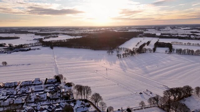 Early Morning Over Icy Rural Areas Featuring Curved Streets And Dispersed Homes With Shadows