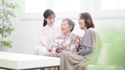 Three-Generation Family: Smiling Women Portraits Videos evoking images of close parent-child bonds, health, longevity, and caregiving Slow motion: Gently watching over with a smile