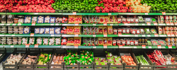 Supermarket showcase of vegetables and fruits. The department of fresh vegetables and fruits in the store, grocery merchandising. High quality photo © Vladimir Razgulyaev