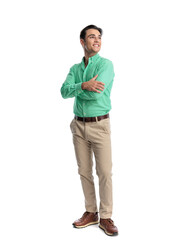 Fototapeta premium Cheerful young man standing with crossed arms looking away