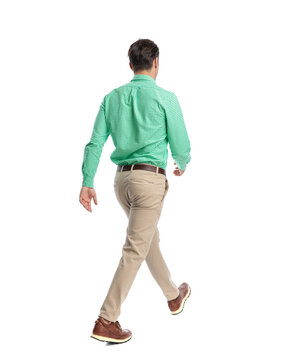 Rear view of casual man walking away