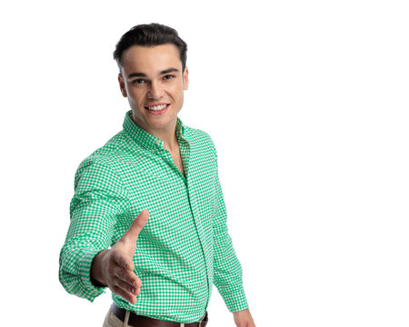 Friendly man extending hand forward for a handshake