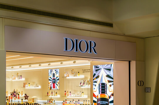 Queens, NY - Jan 10, 2026: Parfums Christian Dior, a luxury cosmetics division of Dior founded in 1946, shown with illuminated signage, fragrance displays at a retail storefront at JFK Airport