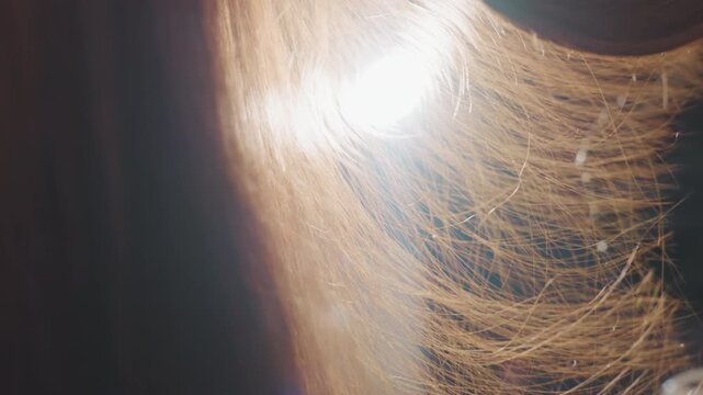 shining locks with soft glow, luminous caucasian hair with shimmering reflections and gentle motion, intimate shot capturing gleaming light reflections and warm highlight effects on hair