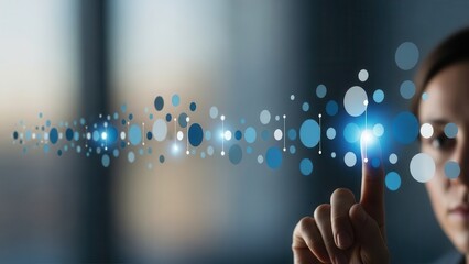 A modern businesswoman's partial profile and delicate hand, softly illuminated, interactively touching an abstract, glowing blue and white digital network interface composed of dynamically connected