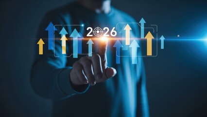 Businessman interacting with futuristic 2026 projection and upward arrows