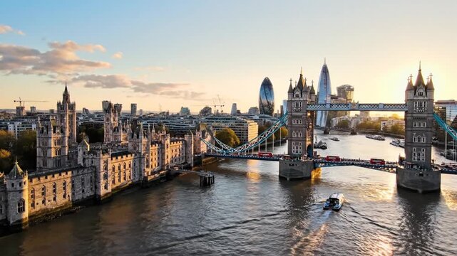 Golden hour over Tower Bridge, Thames glassy and warm; boats glide past historic riverside arches..