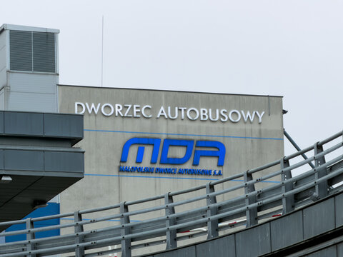 Krakow, Poland - December 1, 2025: MDA brand logo on Dworzec Autobusowy station building, symbolizing modern urban public transport for regional services