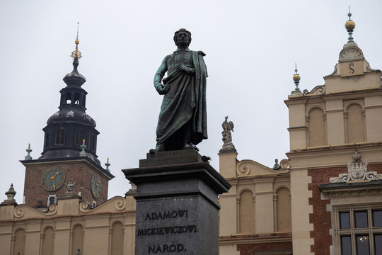 Krakow, Poland - December 1, 2025: Bronze Adam Mickiewicz Monument, ADAMOWI MICKIEWICZOWI NAROD., stands in Main Market Square, showcasing Polish heritage