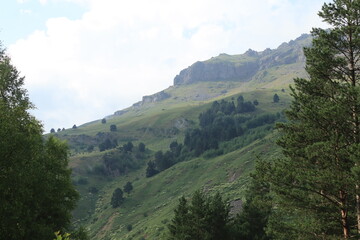 Naklejka premium Mountain landscape of the North Caucasus mountains near Mount Elbrus on a sunny summer day