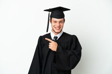 Young university Russian graduate isolated on white background pointing to the side to present a product
