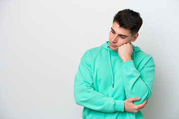 Young caucasian man isolated on white background with tired and bored expression