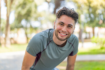 Fototapeta premium Young handsome man wearing sport wear with happy expression
