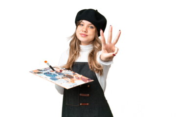 Young artist girl holding a palette over isolated chroma key background happy and counting three with fingers