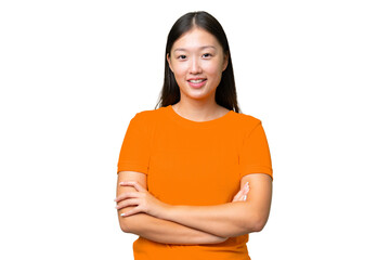 Young Asian woman over isolated background keeping the arms crossed in frontal position