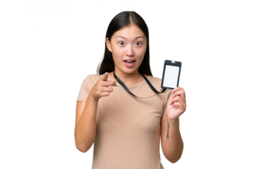 Young Asian woman with ID card over isolated background surprised and pointing front