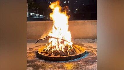 Celebration of Holi festival with bonfire