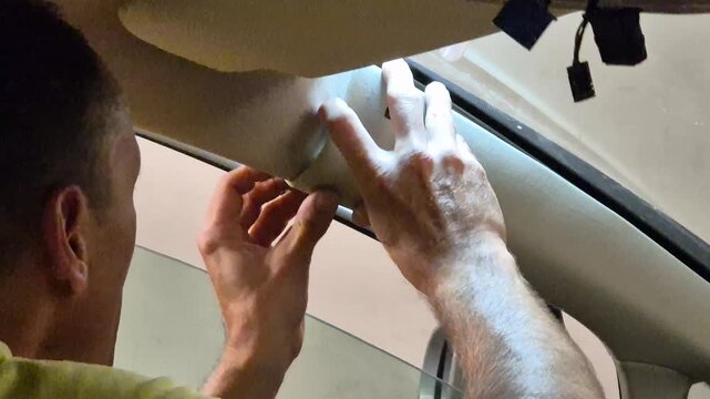 Car repair auto maintenance interior trim installation in a vehicle by a DIY mechanic