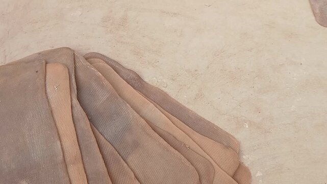 Natural rubber sheet is dried in Sun light at a villege  in Inadia.