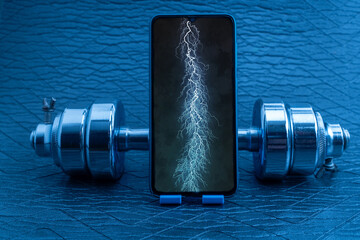Smartphone displaying lightning bolt representing power, strength, and digital energy