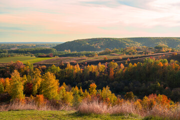Vibrant Autumn Landscape with Rolling Hills and Golden Forests