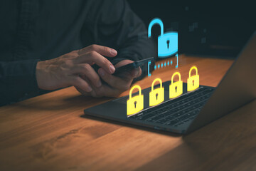 Enhance cybersecurity with data protection. A man uses digital technology for internet privacy, network security, and authentication protection with padlocks on a laptop.
