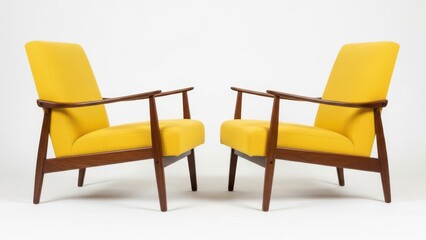 Obraz premium Pair of Yellow Mid-Century Modern Armchairs on White Background