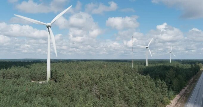 Aerial of wind farm.
Aerial view of wind farm located in a forested area in summer with clouds in the sky, Santala, Hanko, Finland.
