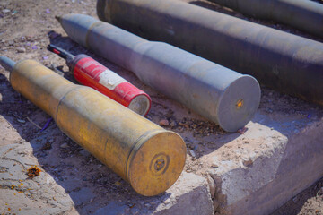 Unexploded Ordnance and Artillery Shells on the Ground. Conflict in the Middle East, military environments.